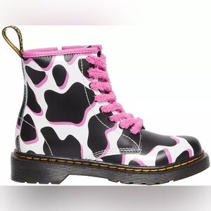 Dr. Martens Kids 1460 cow print patent leather boots in black, white, and pink